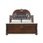 Letto a slitta tradizionale in legno di ciliegio con testiera e pediera intagliate (King)