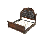 Letto a slitta tradizionale in legno di ciliegio con testiera e pediera intagliate (King)