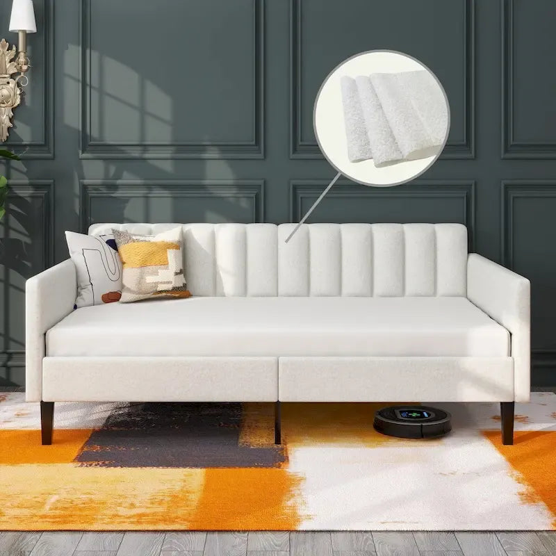 Divano letto singolo imbottito in boucle color avorio con schienale trapuntato a coste